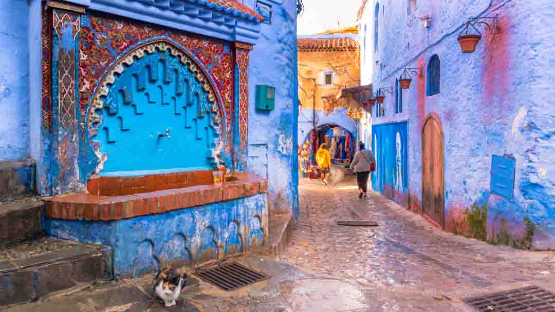 Red and blue fountain on streets of Chefchaouen,Morocco