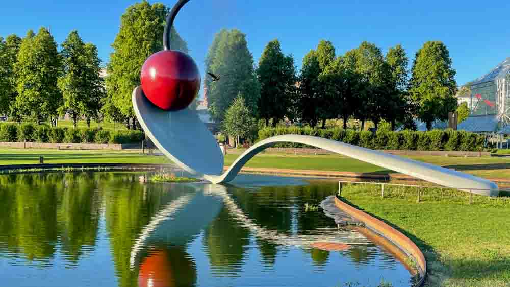Minneapolis sculpture of spoon and cherry in a pond