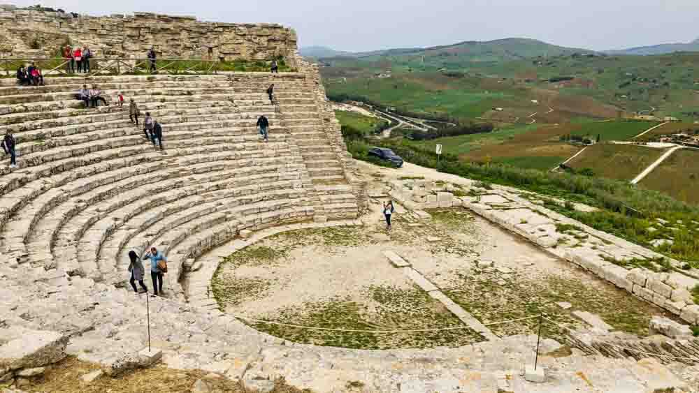  Segesta amphitheater near Temple of Segesta, Sicily, overlooks rolling hills, built in 3rd century BC.