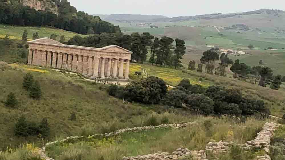 Greek Temple of Segesta, 5th century BC, on an open field in Sicily.